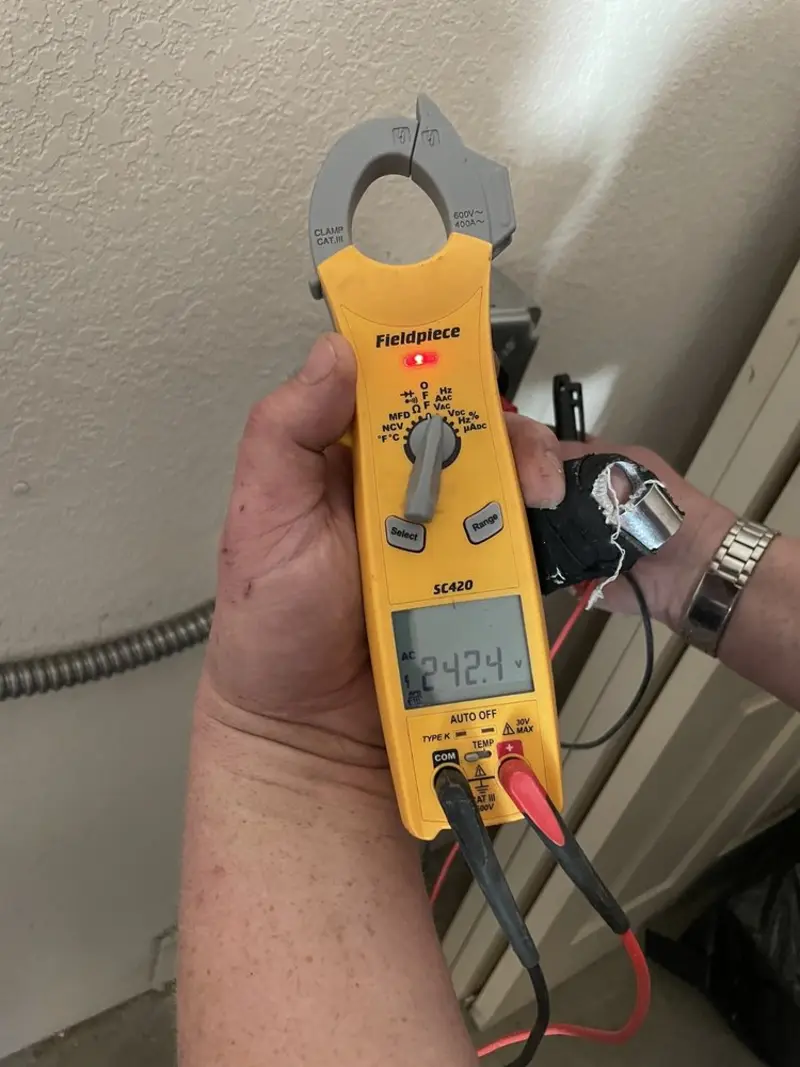 Voltage testing with clamp meter during Whole House Surge Protector in Rye